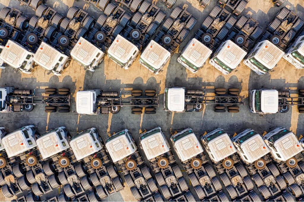 a fleet of trucks undergoing truck maintenance