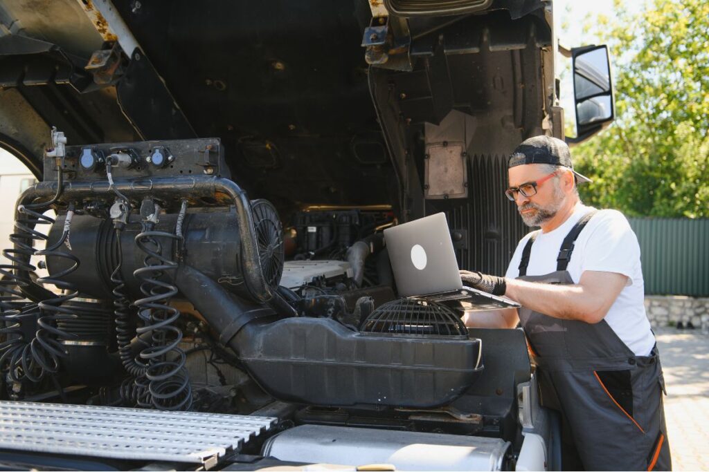 a mechanic conducting truck maintenance