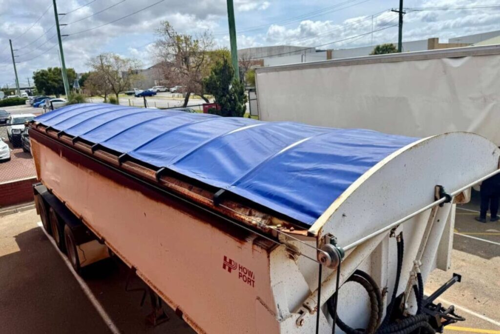Bee Jays Canvas roll tarps for cargo protection.
