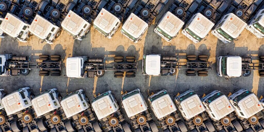 a fleet of trucks undergoing truck maintenance